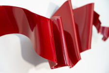 This contemporary wall sculpture is forged from steel and painted red. Image 10