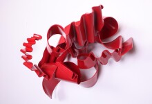 This contemporary wall sculpture is forged from steel and painted red. Image 2