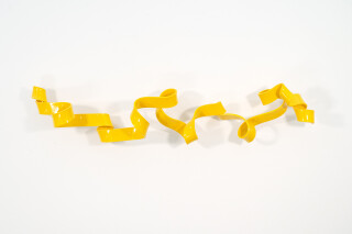 As elegant as a cursive signature, this bright yellow contemporary wall sculpture was created by Stefan Duerst.