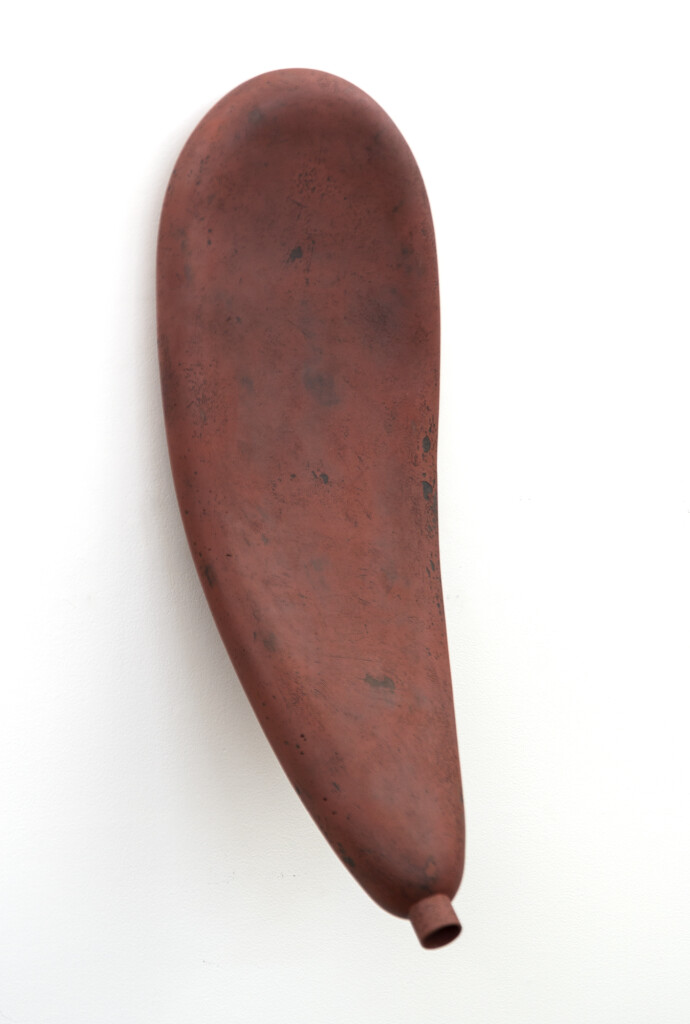 This contemporary sculptural ceramic piece by Steven Heinemann is designed to be mounted on the wall.