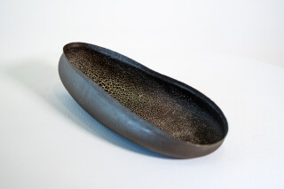 This contemporary ceramic oval-shaped bowl was handbuilt by Steven Heinemann.