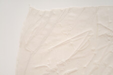 This unique embossed white print was inspired by nature and features tree imagery. Image 7