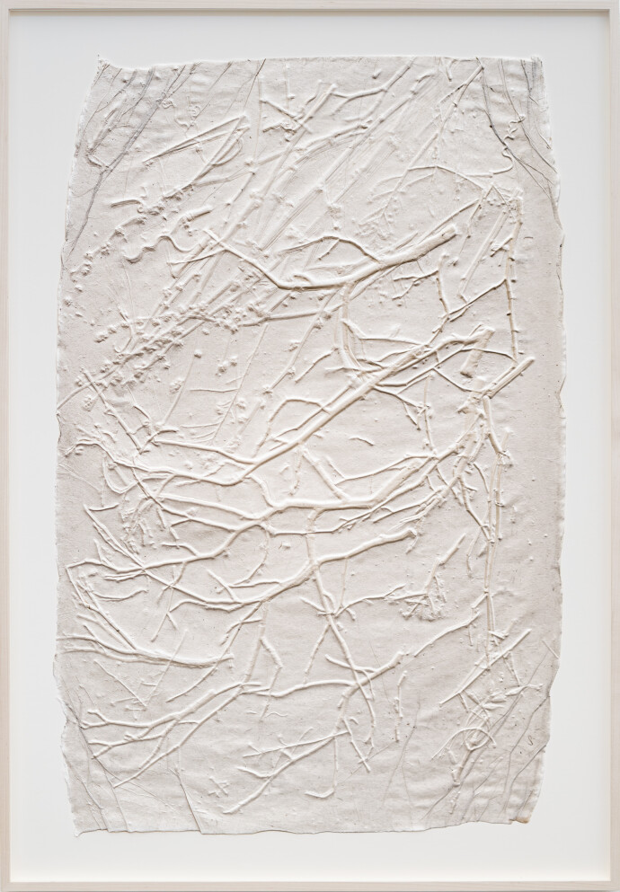 This unique embossed white print was inspired by nature and features tree branch imagery.