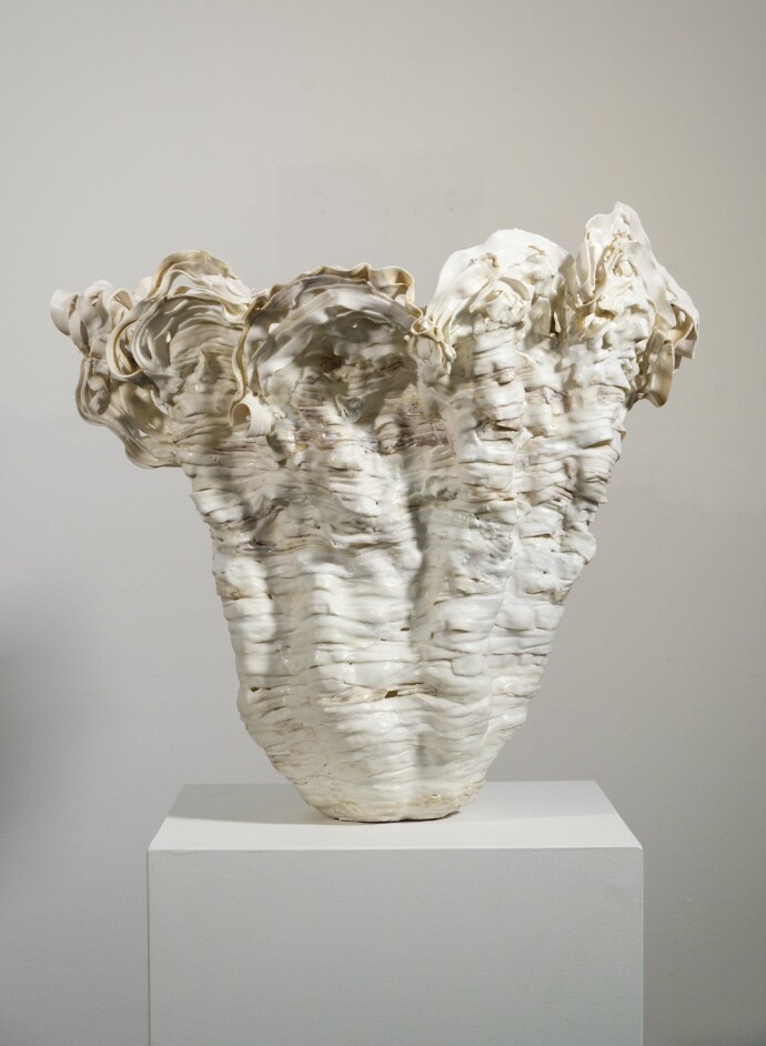 This contemporary sculptural indoor porcelain vessel was made by Susan Collett.