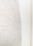 This unique embossed white print was inspired by nature and features tree imagery. Image 6