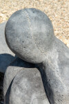This figurative minimalist outdoor sculpture is made of concrete. Image 7