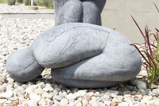 This concrete outdoor sculpture in minimalist form was made by Susan Low-Beer.