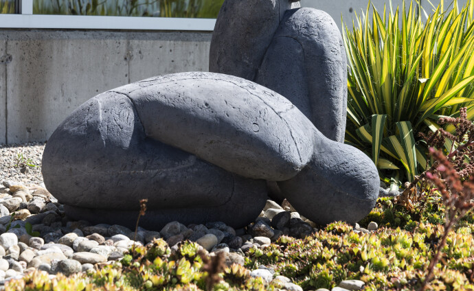 This concrete outdoor sculpture in minimalist form was made by Susan Low-Beer.