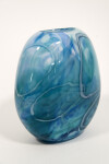 This beautiful aqua blue vessel in blown glass takes its organic shape and wild patterns from nature. Image 2