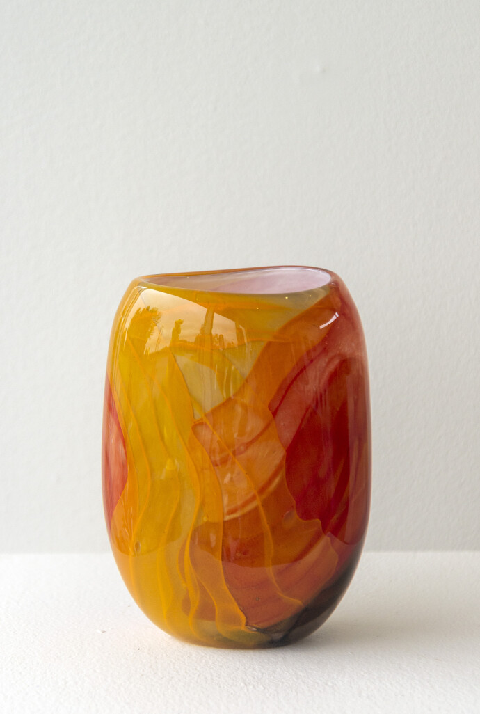 This contemporary red and gold coloured glass vase is by Susan Rankin.