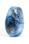 This beautiful swirling sky blue vessel in blown glass takes its organic shape and wild patterns from nature. Image 2