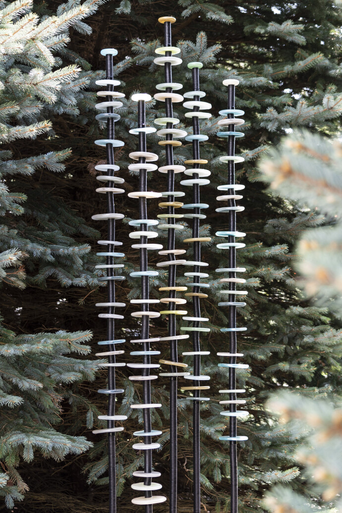 This contemporary, hand-blown glass and steel outdoor sculpture is by Susan Rankin.