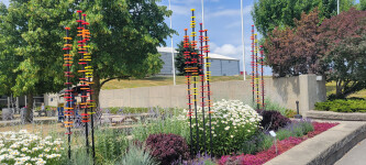 This contemporary glass outdoor sculpture was inspired by nature. Image 3