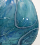 This beautiful aqua blue vessel in blown glass takes its organic shape and wild patterns from nature. Image 5