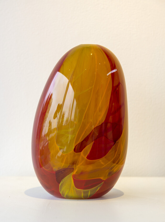 This contemporary red and orange coloured glass vessel is by Susan Rankin.
