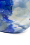 This beautiful blue flattened vessel in blown glass takes its organic shape and wild patterns from nature. Image 7
