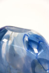 This beautiful blue flattened vessel in blown glass takes its organic shape and wild patterns from nature. Image 8
