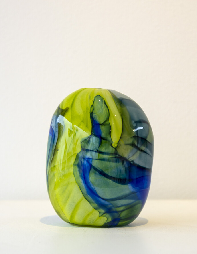 This contemporary lime green and blue coloured glass vase is by Susan Rankin.