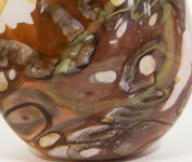 Earthy colours of gold, lime green and chestnut brown swirl in patterns on this lovely glass vessel by Canadian artist Susan Rankin. Image 4