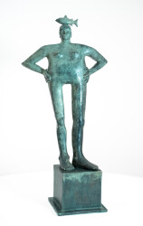 This indoor tabletop figurative sculpture includes a fish and is forged from bronze that is patinated.