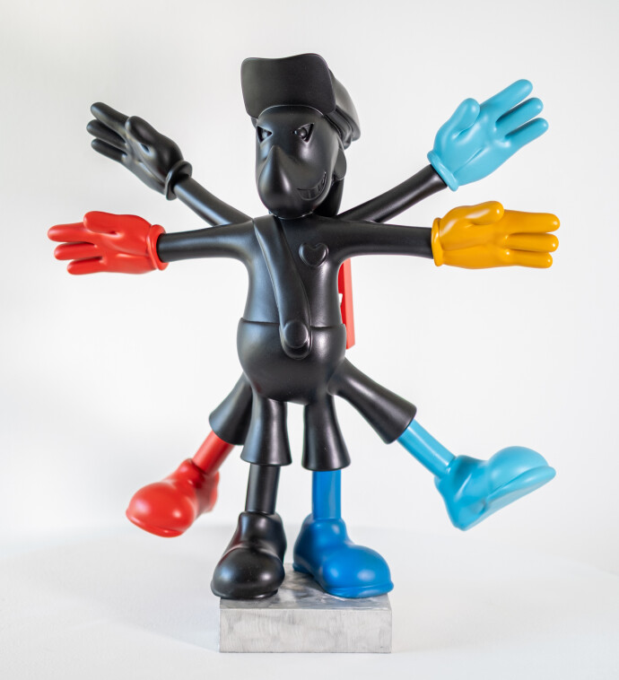 This indoor figurative pop art table top sculpture is made from resin.