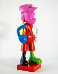 This indoor figurative pop art table top sculpture is made from resin.