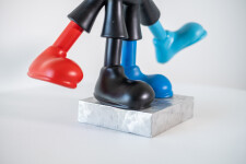 This indoor figurative pop art table top sculpture is made from resin. Image 6