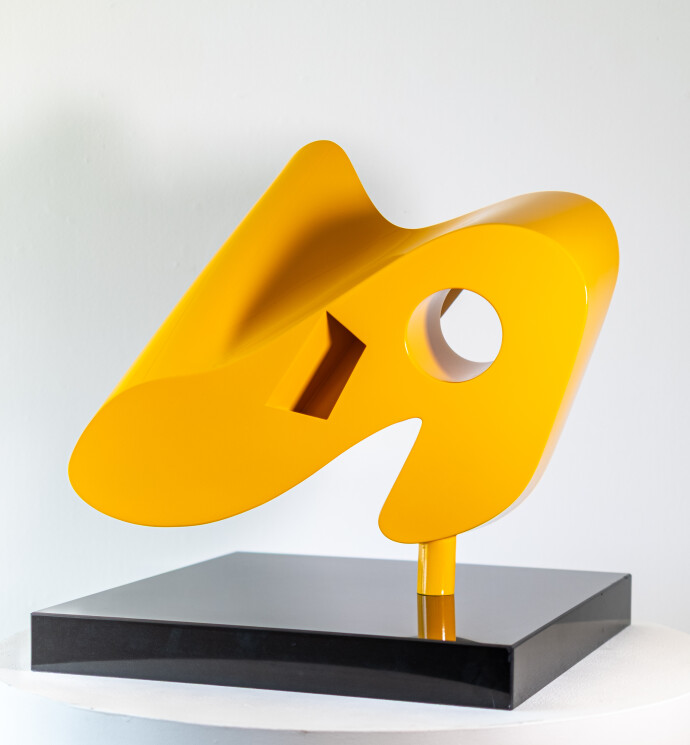 This abstract yellow table top steel sculpture by Viktor Mitic is named after stars.