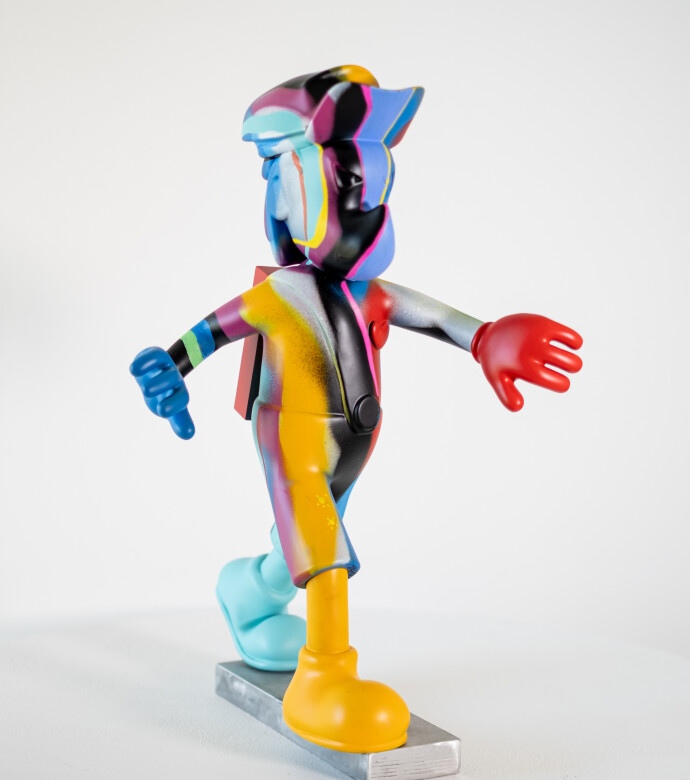 This colourful indoor figurative pop art sculpture is by Viktor Mitic.