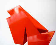 This abstract steel table top sculpture by Viktor Mitic has a red geometric form. Image 8