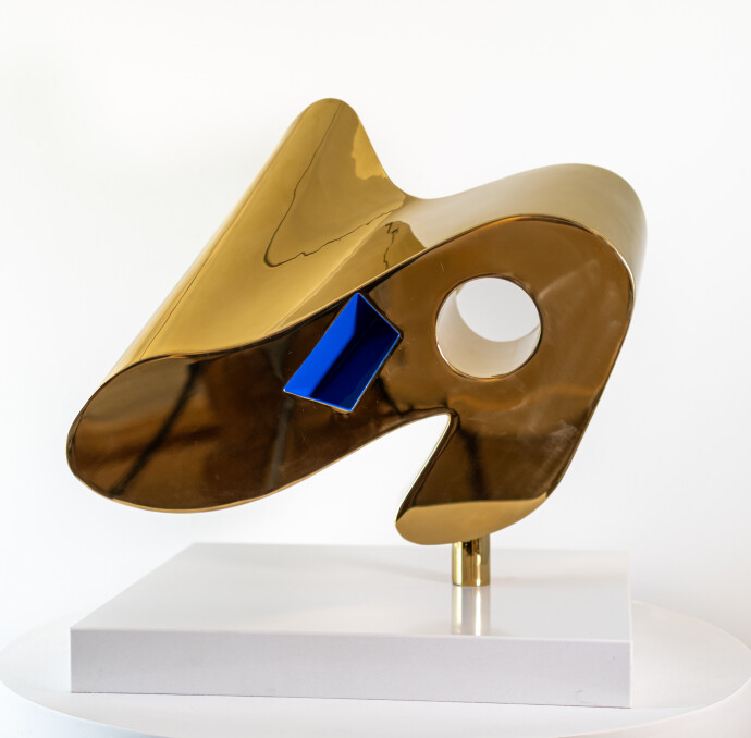 24 Kt Gold plated stainless steel and blue paint.