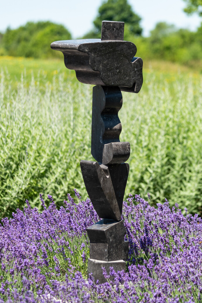 Sculpted from Spanish black marble, this enigmatic and powerful piece was created by Viktor Mitic.