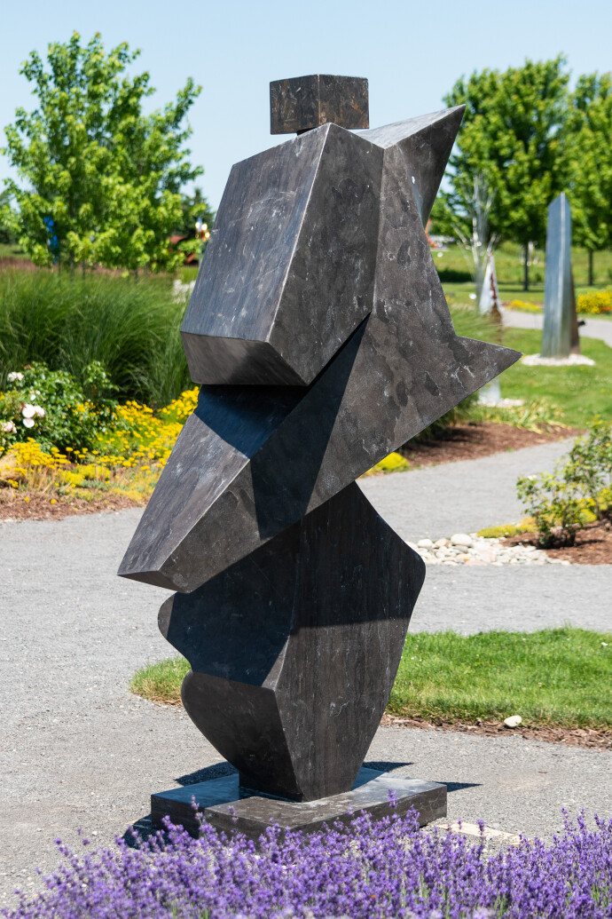 This impressive contemporary sculpture was hand-carved from black marble by Viktor Mitic.