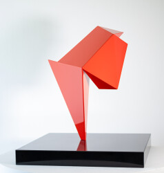 This abstract steel table top sculpture by Viktor Mitic has a red geometric form.